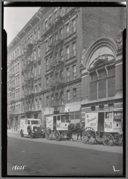Tenement row; Borden's Milk trucks: 315-321 E. 103rd St-1st Av-2nd Av, Manhattan, 1937