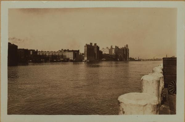 East River - Shore and skyline of Manhattan from East 85th Street - Queensborough Bridge - [Interboro Rapid Transit Building; New York Hospital; Yorkville Ice Sales Corporation.], 1931–1933