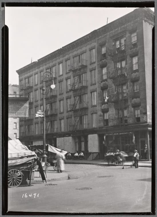 Tenements & storefronts; Cut Rate Bakery: Monroe St.-Rutgers St., Manhattan, 1936