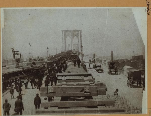 Bridges - Brooklyn Bridge - [View of the sightseeing public walking the length of Brooklyn Bridge during its construction.], ca. 1884
