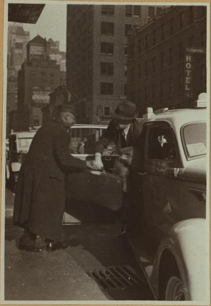 Street scenes - "Red cap" [aiding passengers in front of the Grand Central Station.], 1937