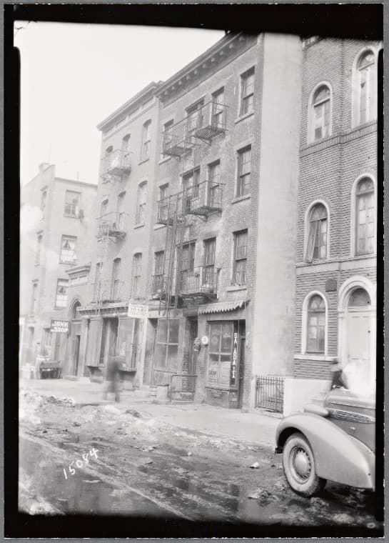 Tenements and storefronts; Geo. Apostolopolous Undertaker: W 43rd St. - 6th Ave., Manhattan, 1936