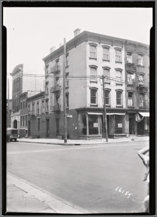 Brick row houses with vacant shops: Hicks St. - Sackett St., Brooklyn, 1936