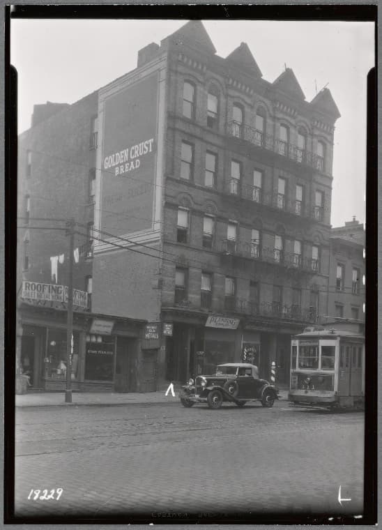 Tenements & storefronts; Sun Roofing; trolley car: 2609-2617 3rd Av-E. 128th St., Manhattan, 1937