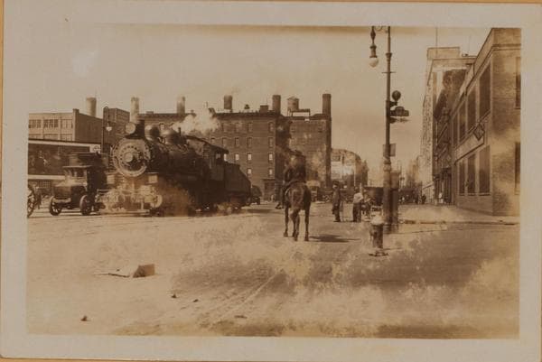 Manhattan: 11th Avenue - 54th Street: Eleventh Avenue, north from and including 54th Street. Eleventh Avenue, with the railroad running down it from 60th Street, used to be nicknamed "Death Avenue;" but by the time of this picture the danger is more from the automobiles., 1927-05-20