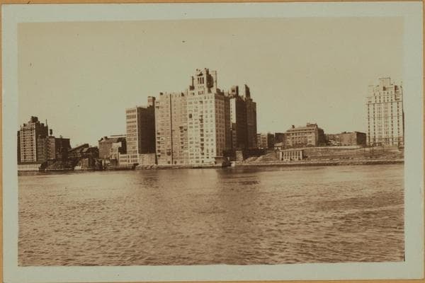 East River - Shore and skyline of Manhattan from East 85th Street - Queensborough Bridge - [Interboro Rapid Transit Building; New York Hospital; Yorkville Ice Sales Corporation.], 1931–1933