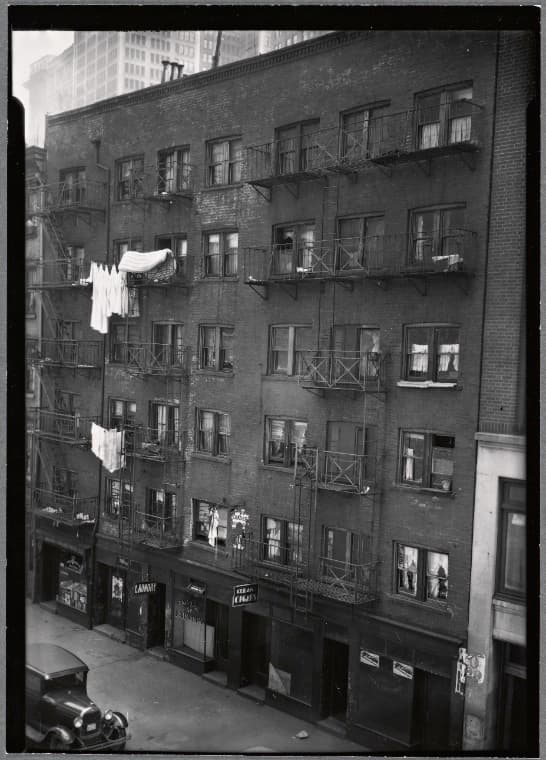 Tenements and storefronts; Sam Lee Laundry: 25-27 Washington St.-Battery-Morris St, Manhattan, 1934