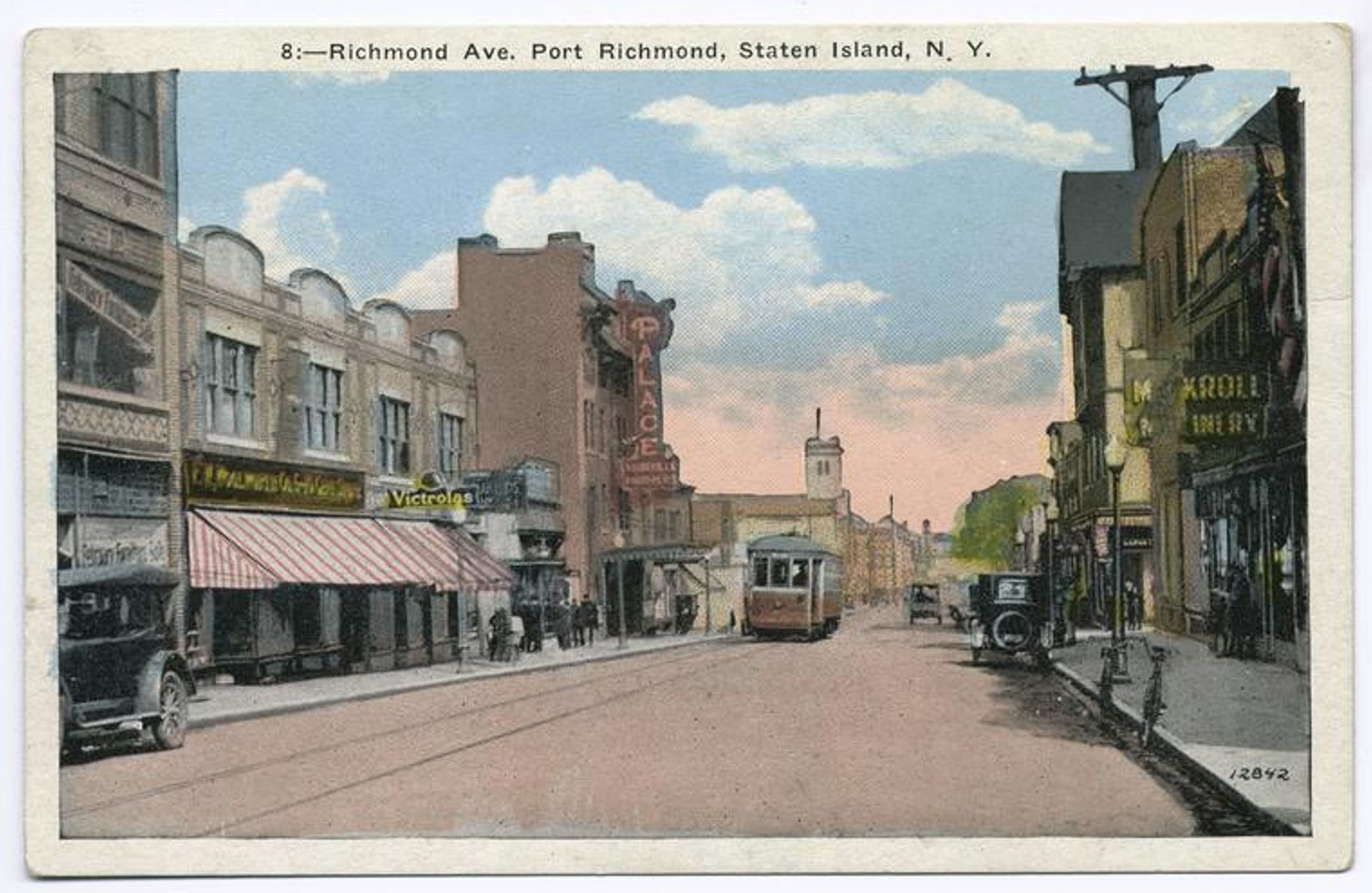 Richmond Ave. Port Richmond, Staten Island, N.Y. [trolley, old cars, people walking, shops on both sides of street, shop selling 'Victrolas', Palace theater]