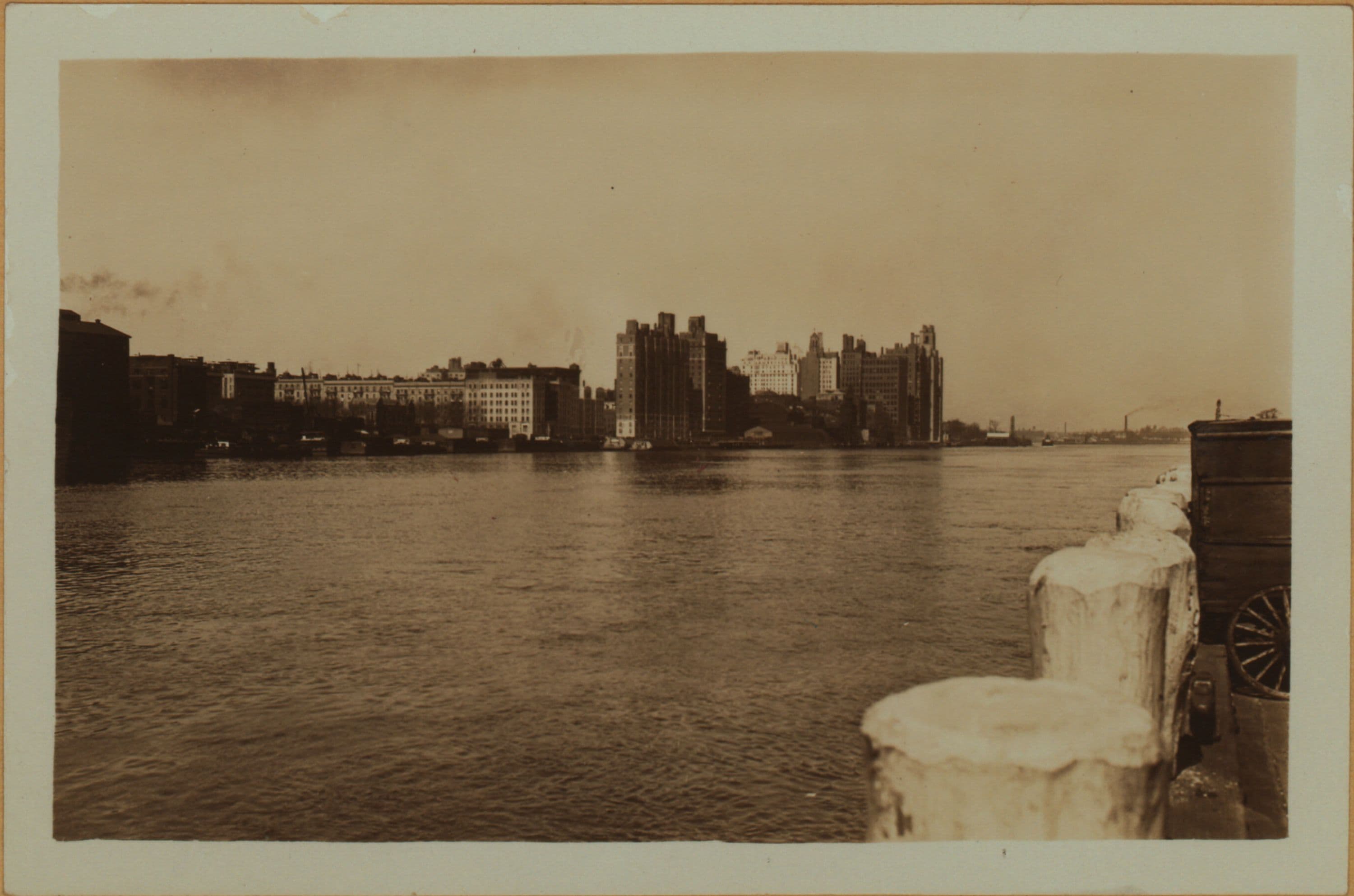 East River - Shore and skyline of Manhattan from East 85th Street - Queensborough Bridge - [Interboro Rapid Transit Building; New York Hospital; Yorkville Ice Sales Corporation.]