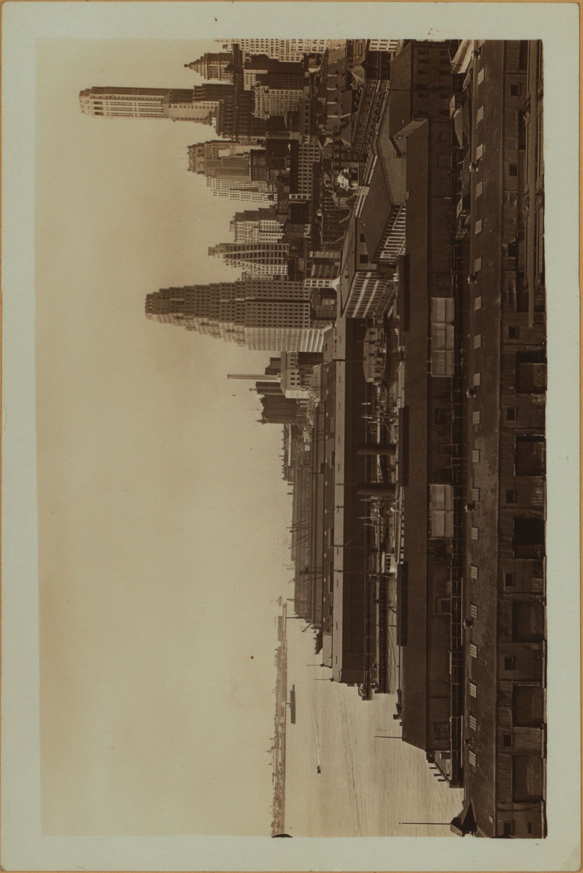 East River - shore and skyline ; South ferry, Williamsburg bridge. [Manhattan: Dover Street.]