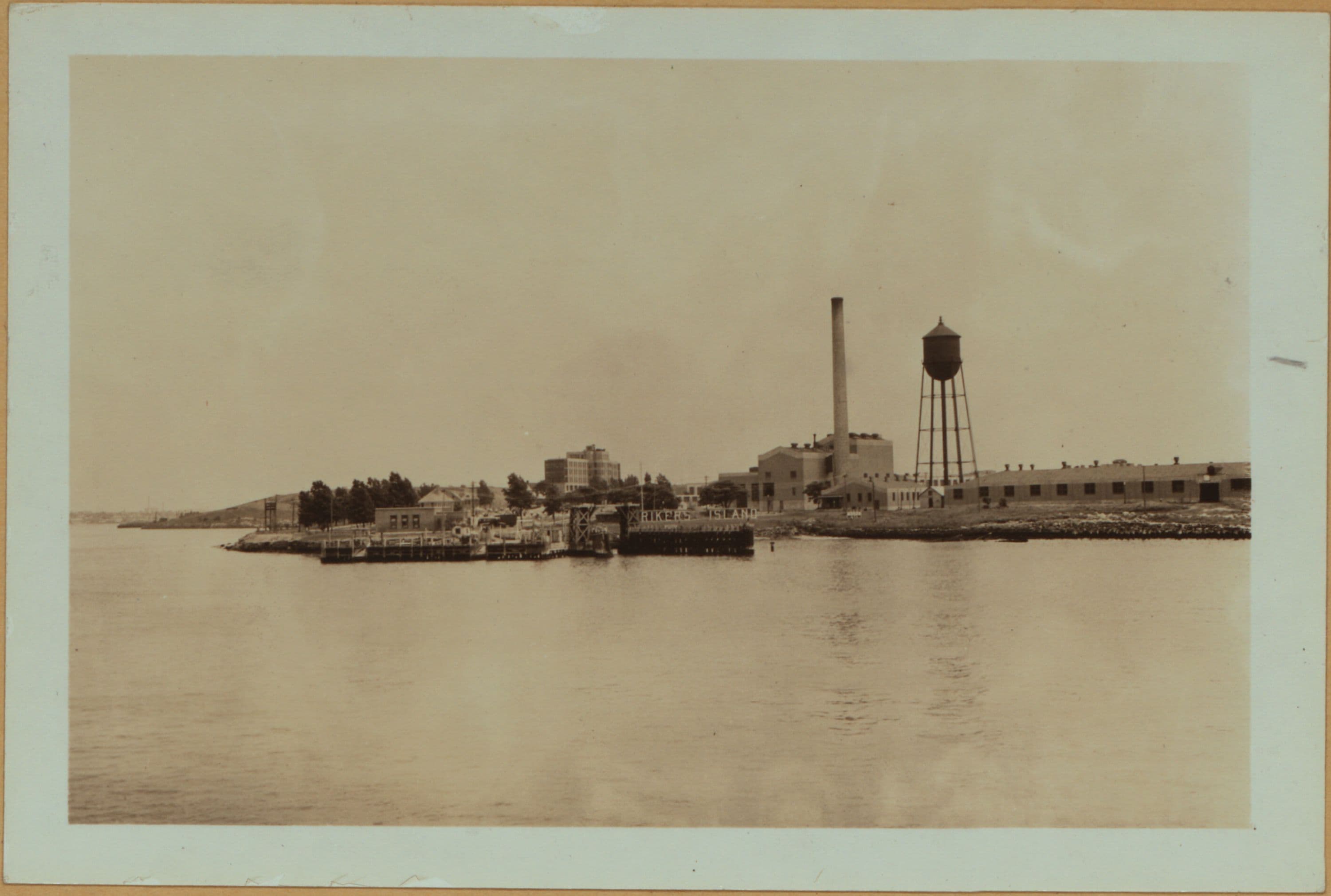 Islands - Rikers Island - [Ferry slip - Prison buildings.]