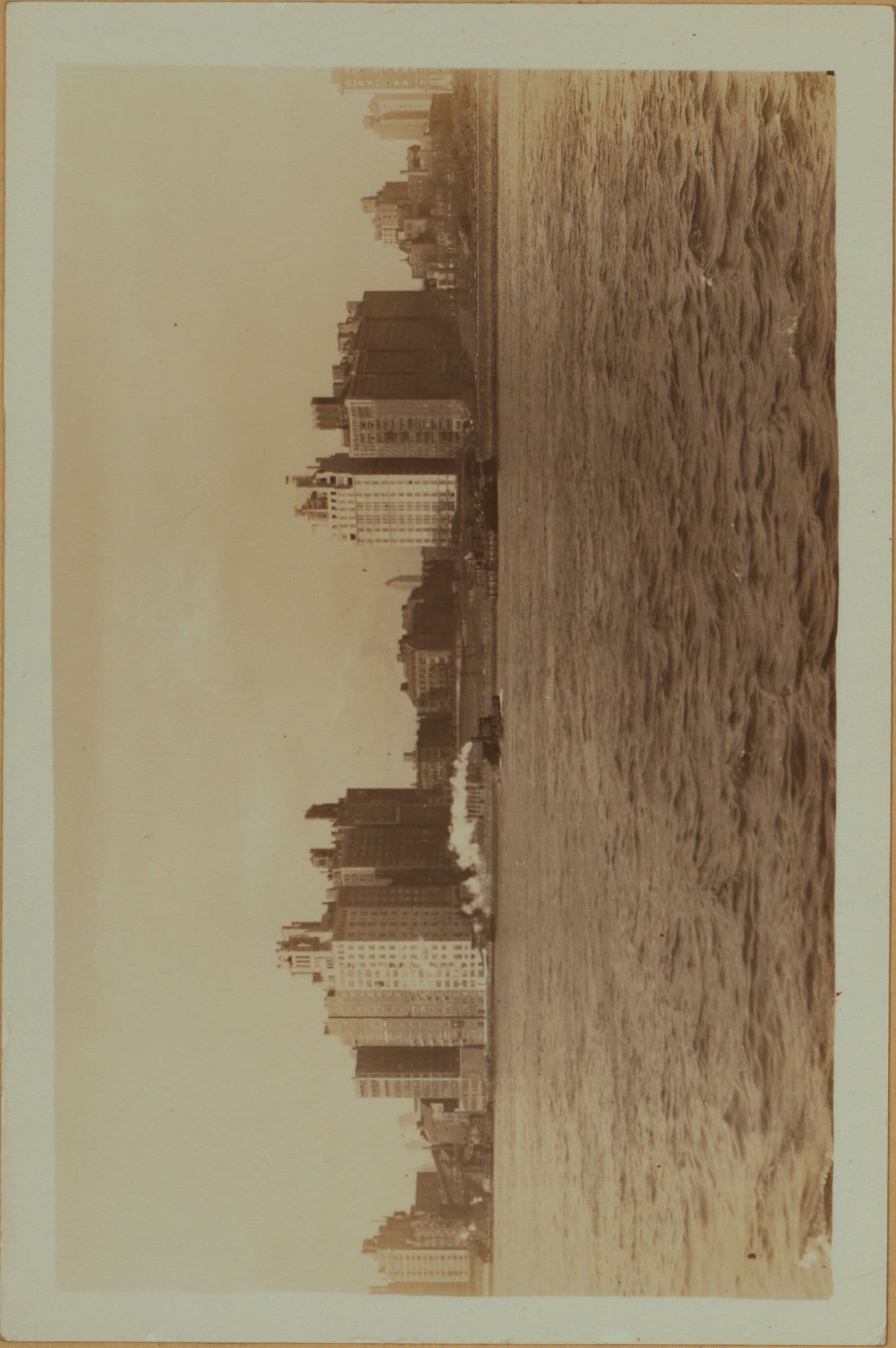 East River - Shore and skyline of Manhattan between East 80th and 87th Streets - Queensborough Bridge - [Brearly School ; Miss Chapin's School ; Yorkville Ice Sales Corporation.]