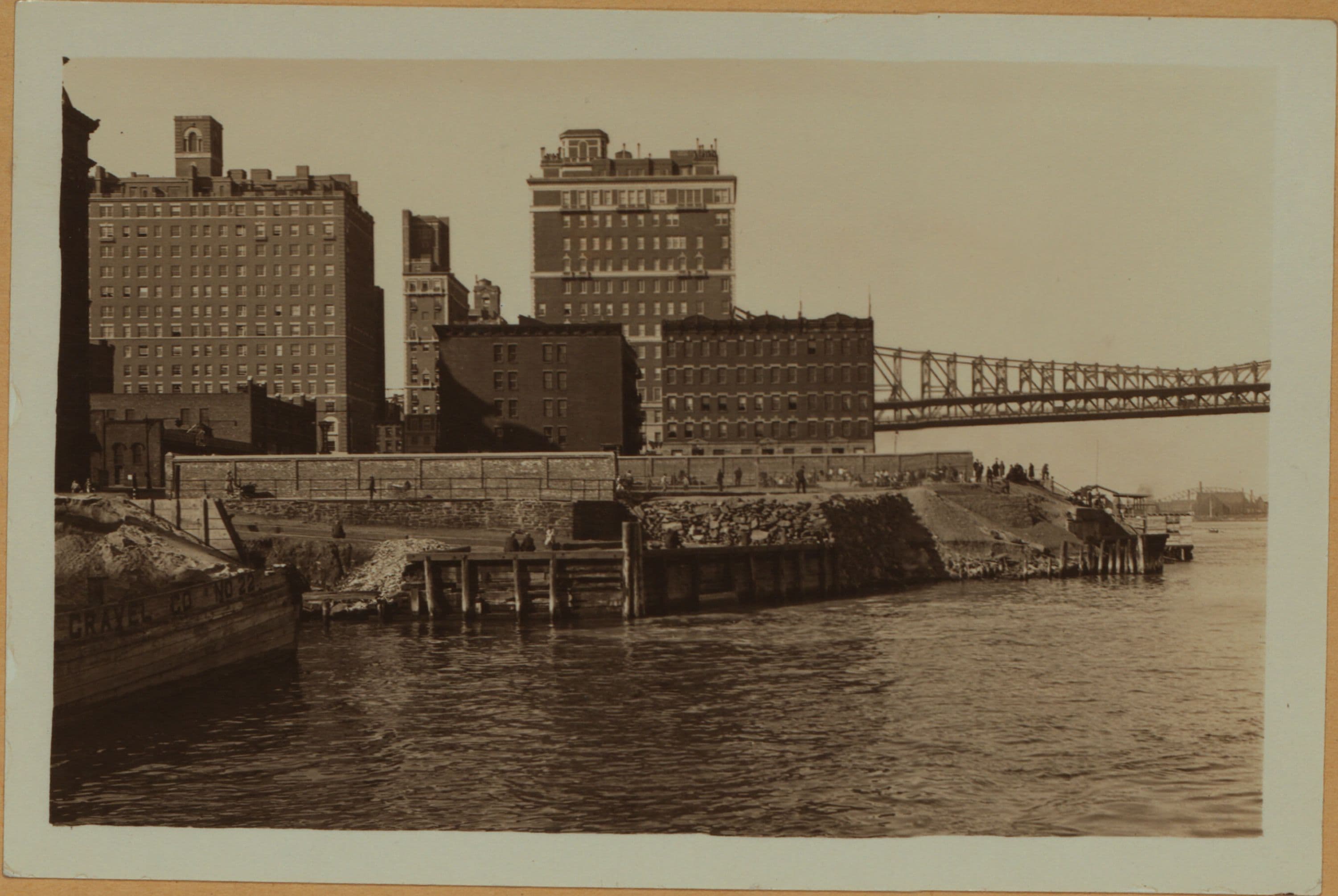East River - Shore and skyline of Manhattan between East 54th and 55th Streets - [Sutton Place] - Williamsburg and Queensborough Bridges., 1933–1937