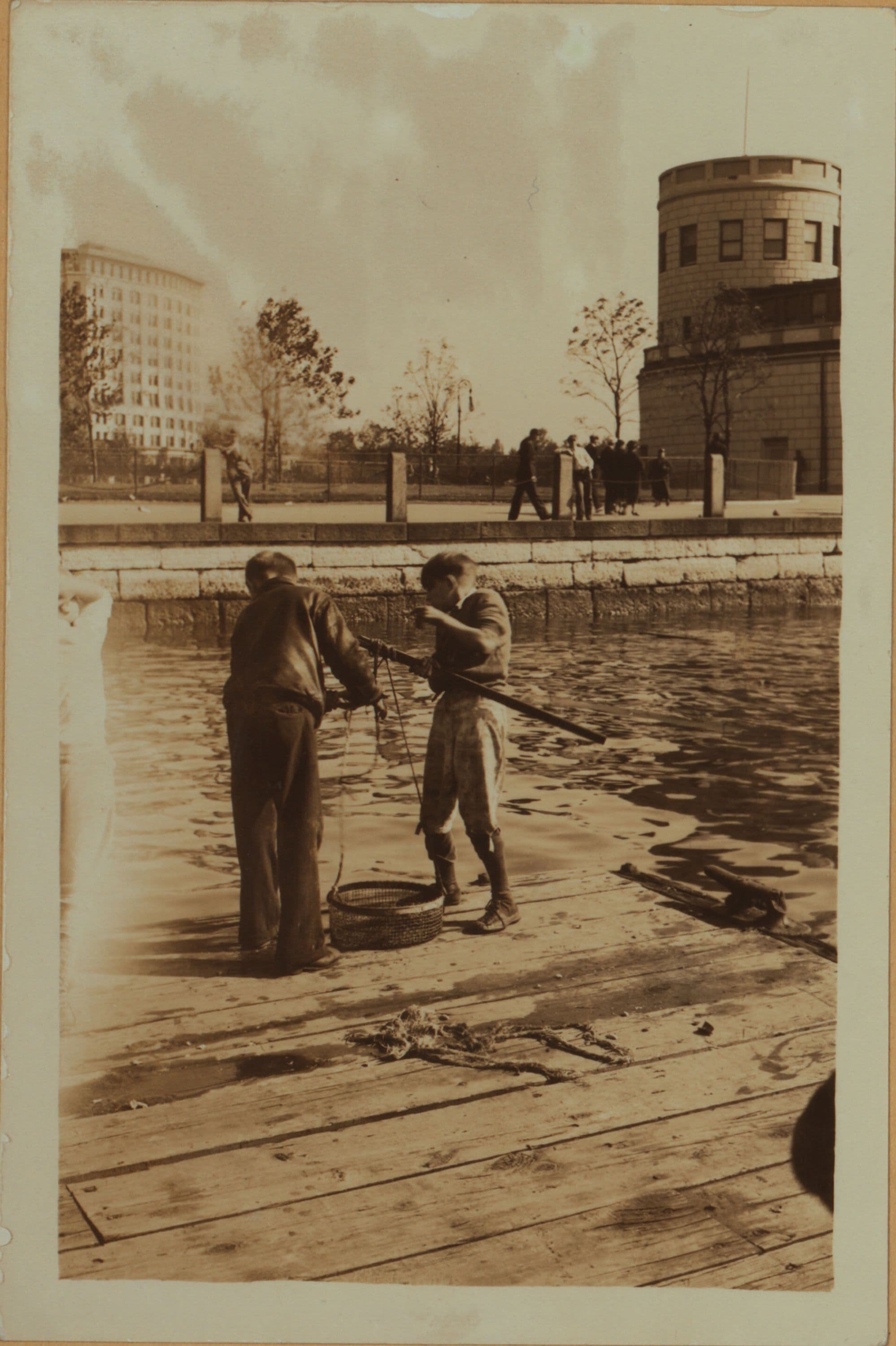 Recreation and hobbies - Fishing [off the police dock at Battery Park.]