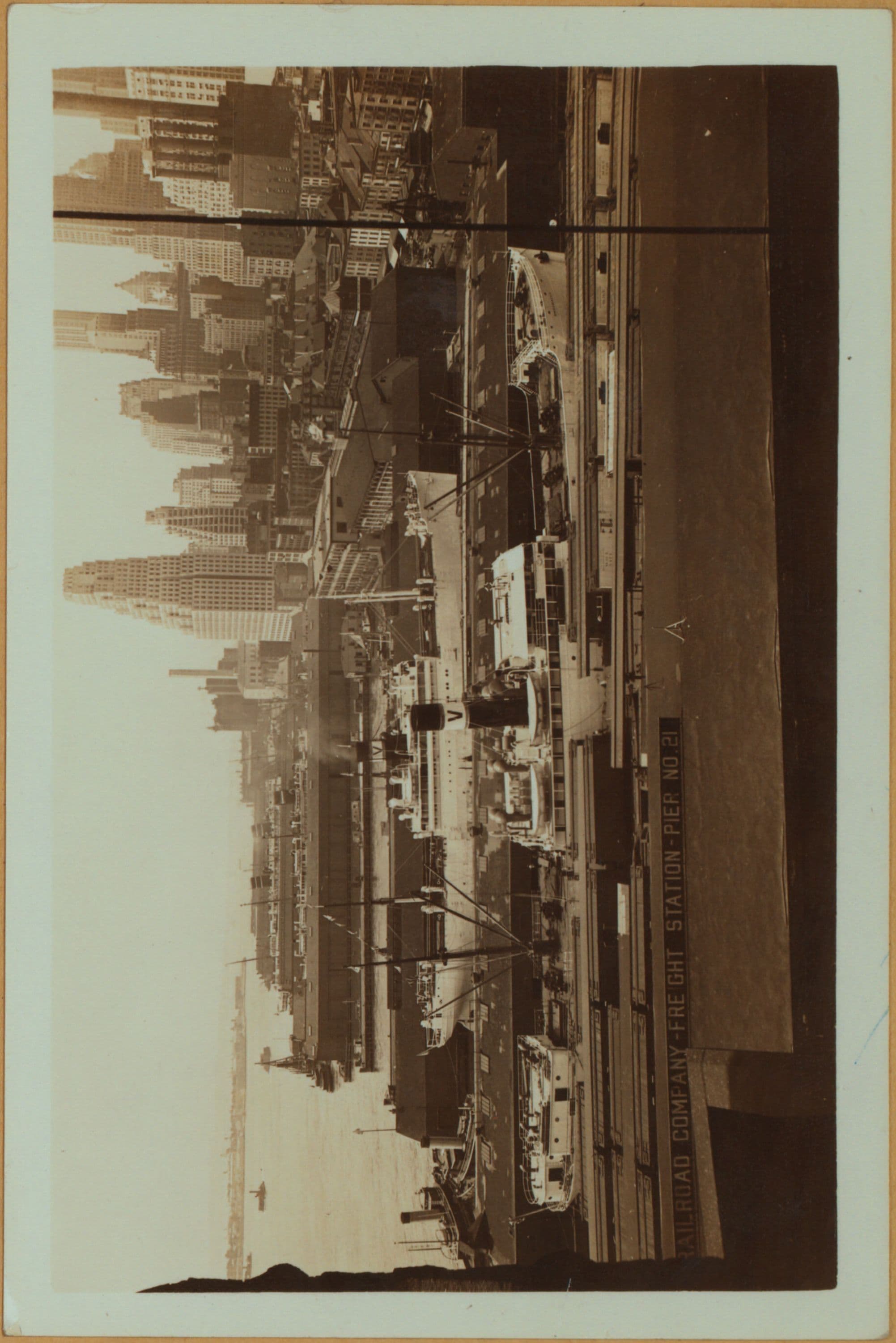 East River - shore and skyline ; South ferry, Williamsburg bridge. [Manhattan: Dover Street.]