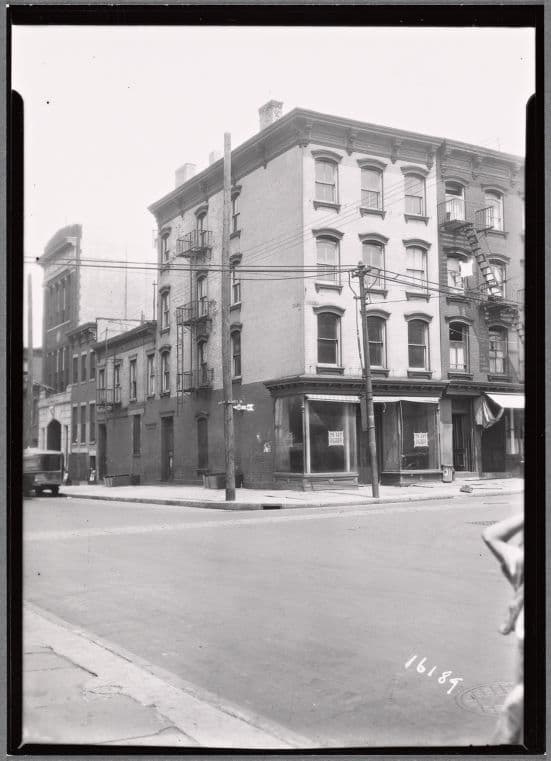 Brick row houses with vacant shops: Hicks St. - Sackett St., Brooklyn
