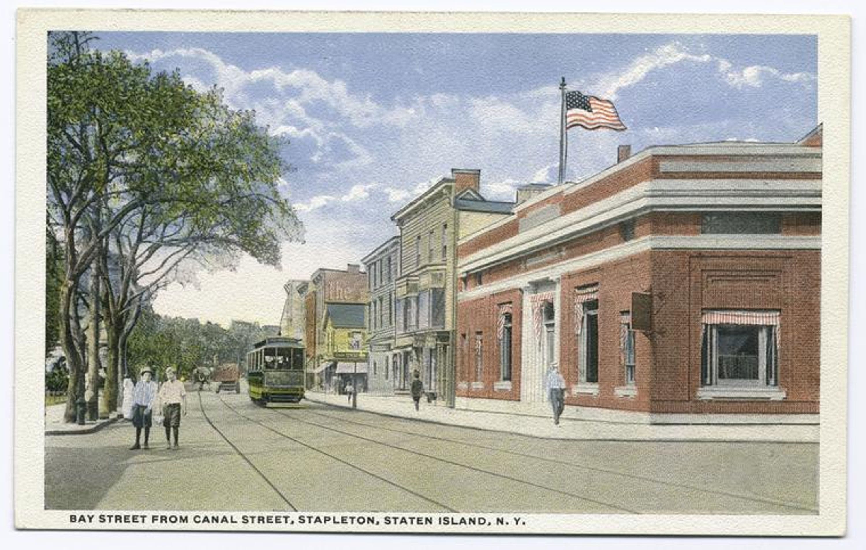 Bay Street from Canal Street, Stapleton, Staten Island, N.Y. [boys in knickers on street, trolley car, shops on one side of street, edge of Washington Park on other side]