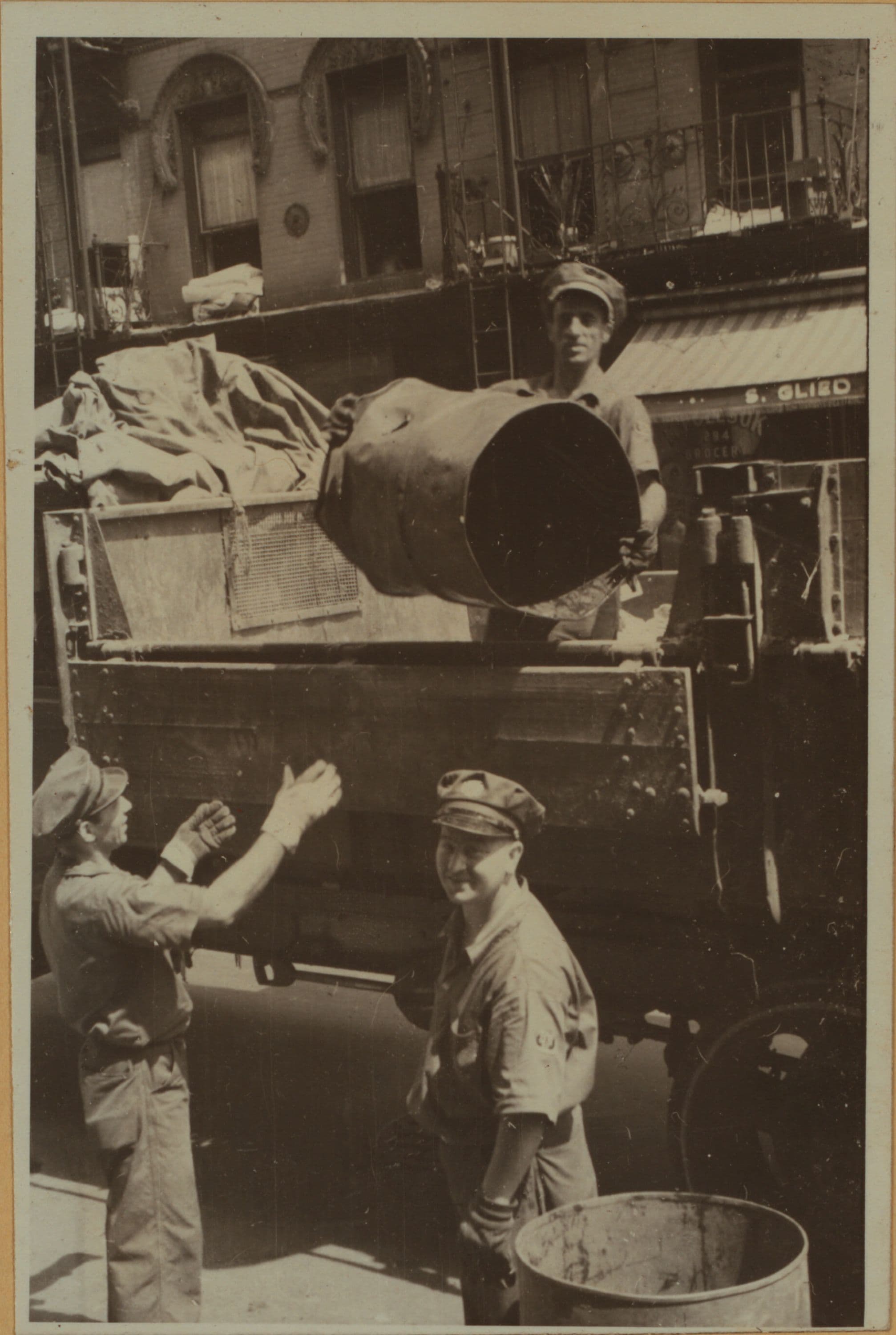 Workmen - [Delivering coal - Old fashioned Department of Sanitation truck.], 1930