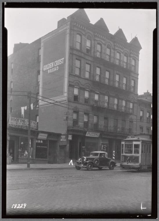Tenements & storefronts; Sun Roofing; trolley car: 2609-2617 3rd Av-E. 128th St., Manhattan