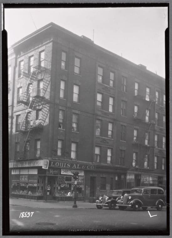 Tenement & stores; Louis Al. & Co., LaSala's Restaurant: 58 Kenmare St. - Mott St., Manhattan]