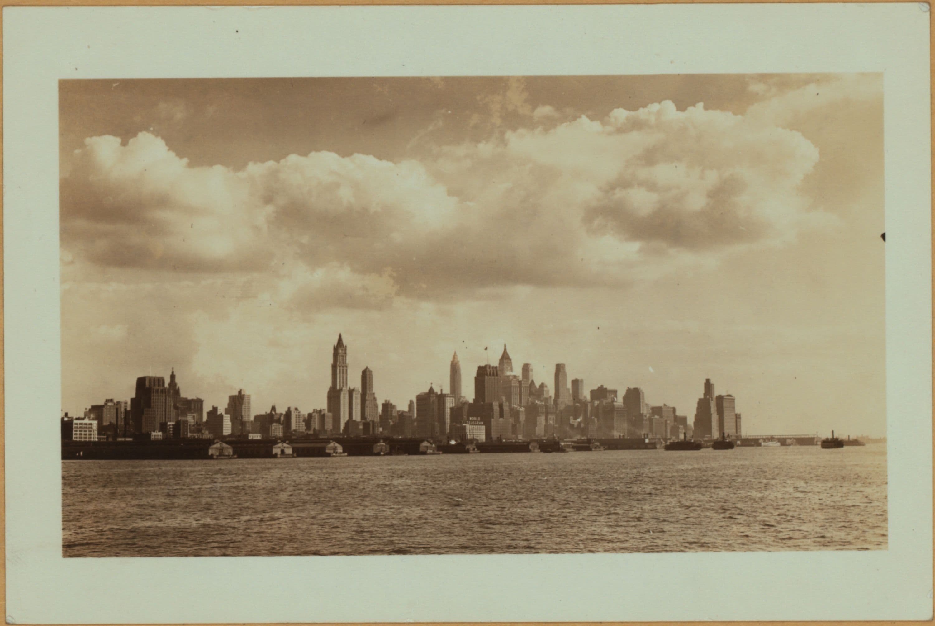 North (Hudson) River - Shore and skyline - Manhattan - Battery - 14th Street - [Bank of Manhattan - Irving Trust Company - New York Telephone Company - Singer Manufacturing Company - Transportation Building - Woolworth Building.]