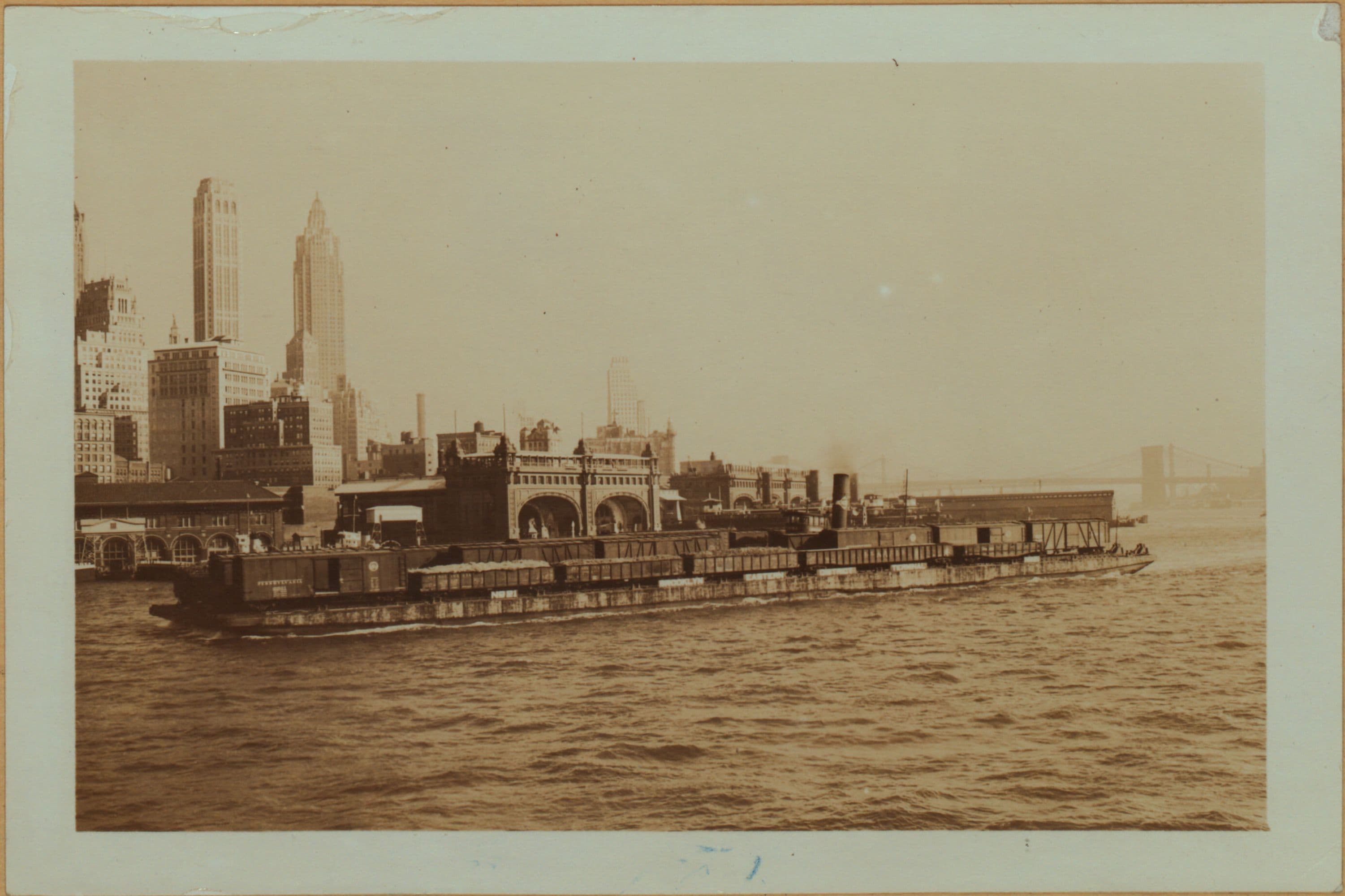 East River - Shore and skyline of lower Manhattan - South Ferry - Williamsburg Bridge - Battery Park - Broad Street - [South Brooklyn Municipal Ferry.]