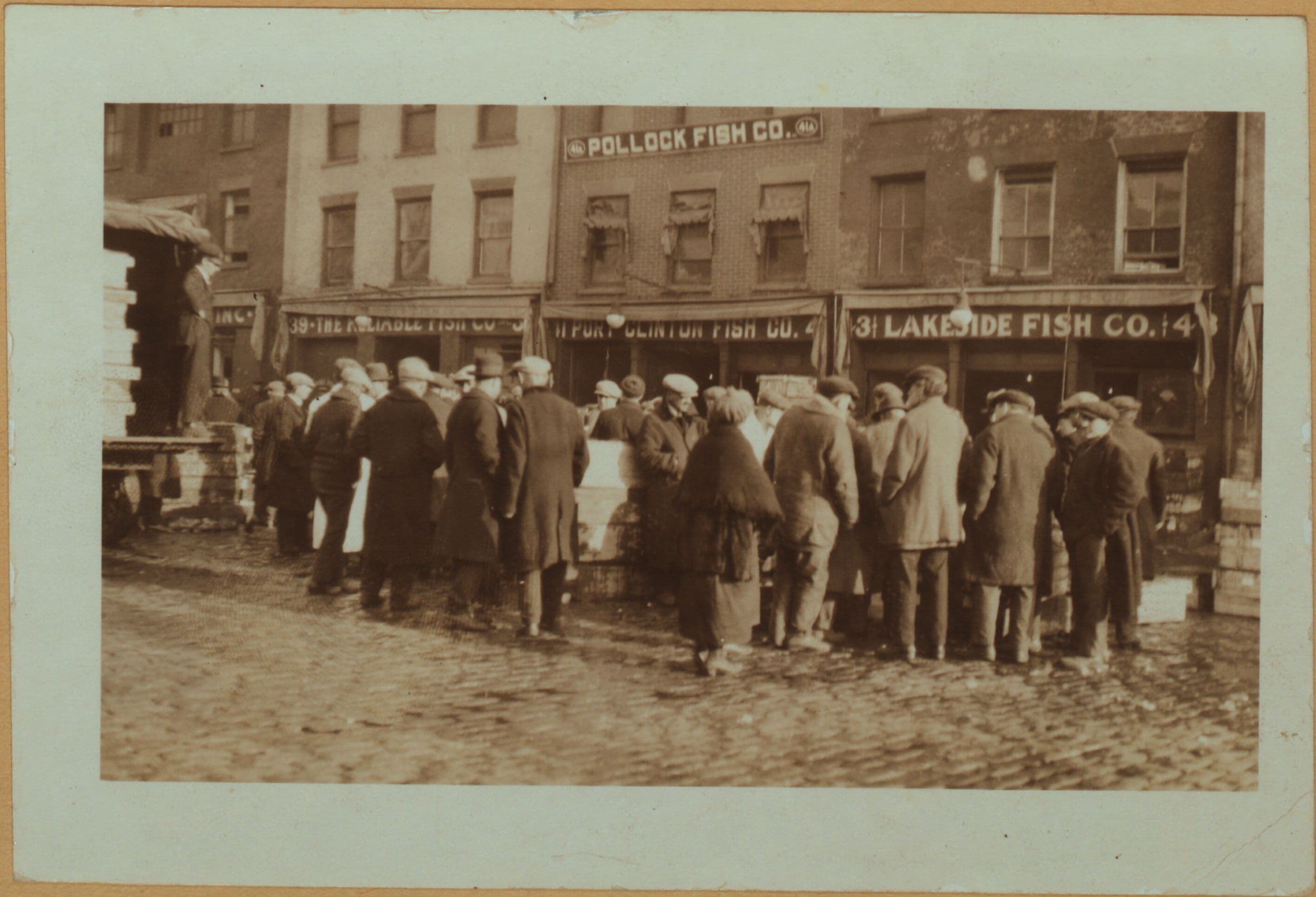 Fulton fish market - [Packaged fish under auction in Peck Slip.]