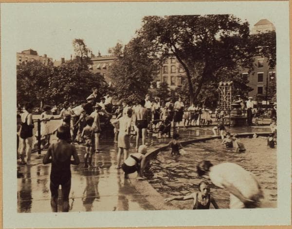 Manhattan: Washington Square North - 5th Avenue: Washington Square Park, showing the center fountain with the Washington Arch in the background, with children at play in the water. 18-22 Washington Square North, west of Fifth Avenue, are the houses in background., 1932-09-06