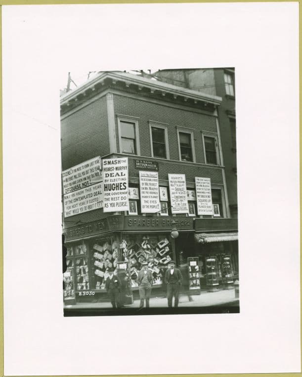 Social conditions: Sparber Bros. Men's Clothing at Grand & Forsyth Street.
