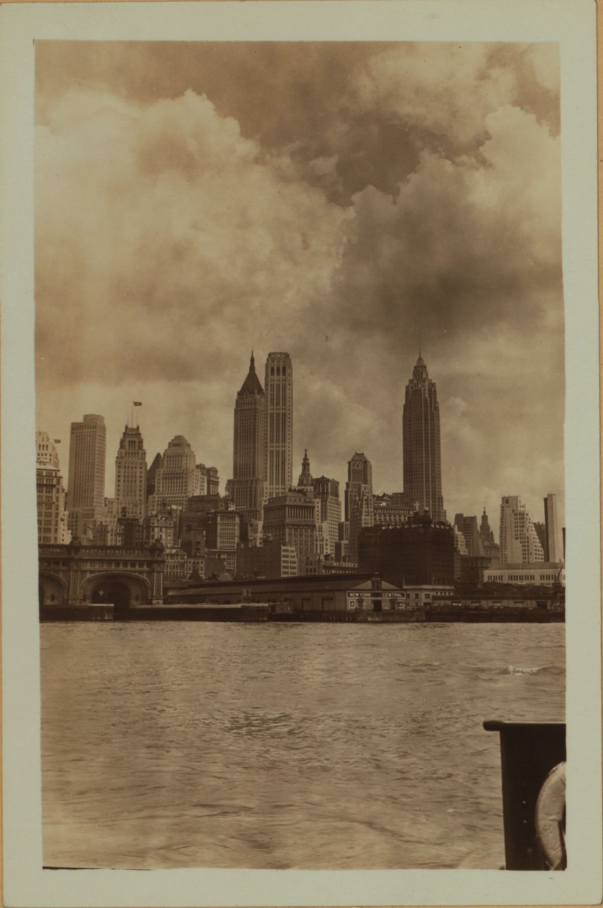 East River - Shore and skyline of lower Manhattan - South Ferry - Williamsburg Bridge - Moore Street - Coeties Slip.