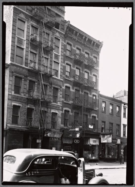 Tenements & storefronts; Scandron's Opticians: 399-403 Grand St.-Clinton-Suffolk, Manhattan, 1936