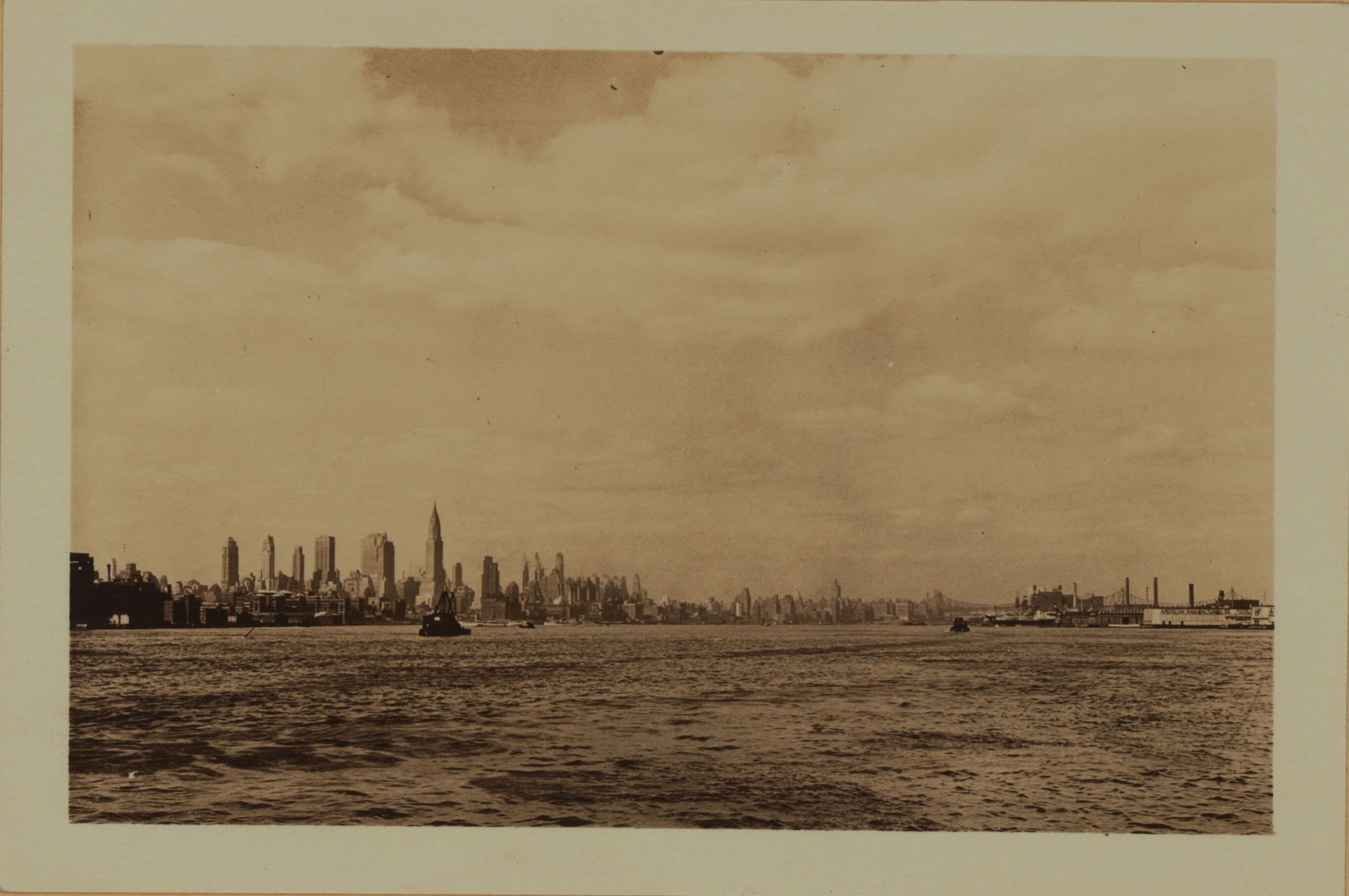 East River - Shore and skyline of Manhattan from East 24th Street - Williamsburg and Queensborough Bridges.